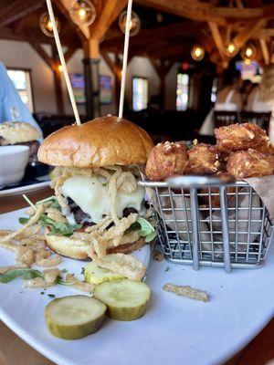 Griffon burger with sour cream, cheddar, and chives tots