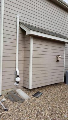 Radon Mitigation System Exterior Install Painted to Match Trim