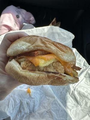 Vegan breakfast sandwich with just egg, a brioche bun, cheddar cheese, and bacon