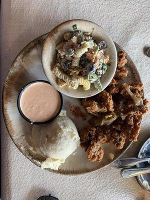 Chicken livers, mashed potatoes, and pasta salad