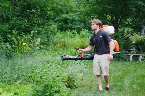 Our technician applying our organic eco-barrier product to eliminate ticks and mosquitoes.