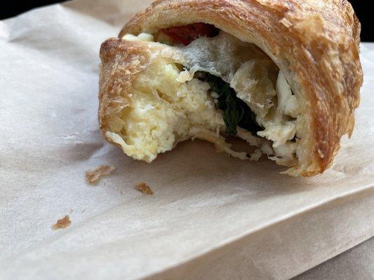 Half-eaten veggie croissant (loved it)