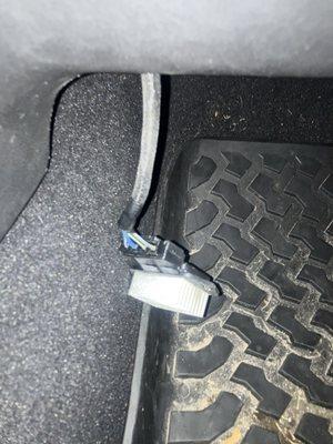 Extremely hot control box of some kind left hanging on passenger side after "service"