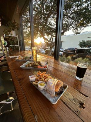 First floor table facing Minnesota street. We ordered a burger + fries, salt + pepper wings & tacos.