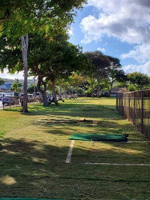 There are picnic tables scattered around the Kahala Community Park.