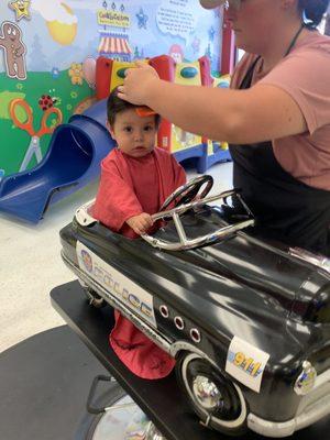 Getting his haircut!