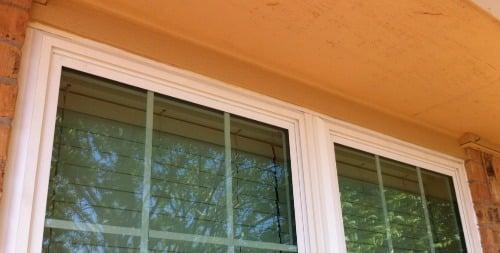 Trim detail above window - they added it and then color matched our existing house paint color to finish the job!