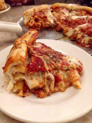 Stuffed pizza with pasta, meatball, and mushroom