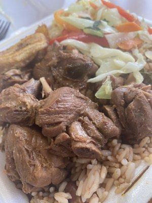 Brown stew chicken, cabbage with peas and rice