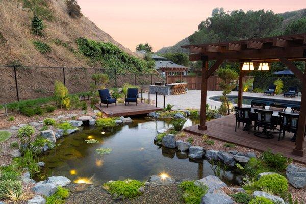 Koi pond built in Bel Air, California - 35' Curved x 18' Wide. About 1 month after construction was complete and the plants have taken off!