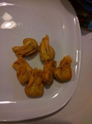 Friend wontons, little drops of meaty delicious flavor.