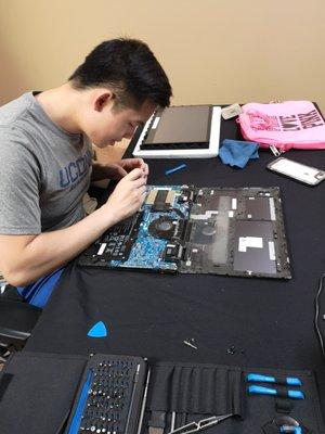 An HP Envy laptop getting the motherboard installed!