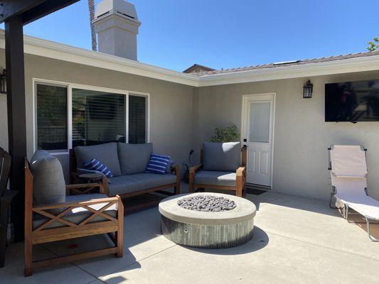 A new outdoor living space with fire pit in Carlsbad, designed and built by Landscape Logic