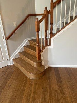 These were old blue carpeted stairs. StarFloors put new flooring throughout the house, and handcrafted the stairs to match. Amazing!