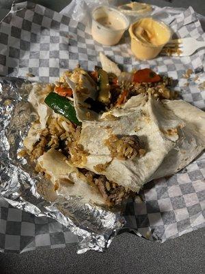 Deconstructed burrito.An Abomination of a so called steak burrito that split prior to opening the wrapper around the burrito.