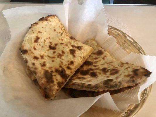 Darbar Special Naan White Bread stuffed with Onions, Potatoes, Cheese and Baked in Tandoor