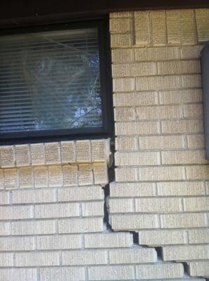 Brick veneer cracks caused by foundation settlement.