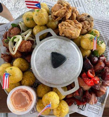 El Tetazo: Skirt steak, chicken breast, fried pork, fried chicken, mamposteao rice, mofongo balls, tostones, fries, sodas - 4 or 5 People