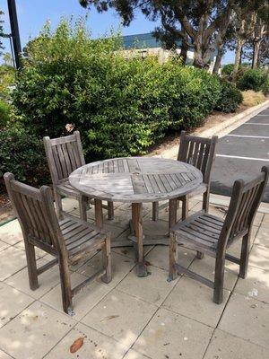 Teak table before pressure washing