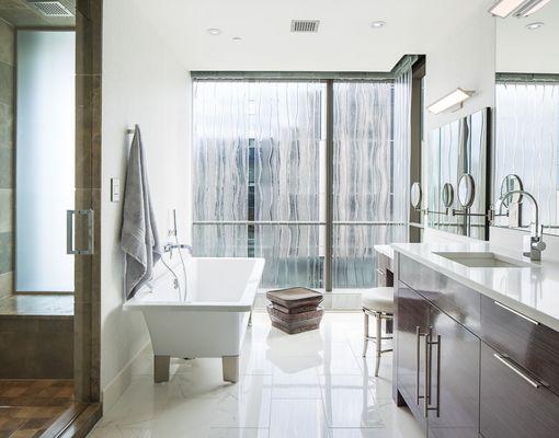 Custom cast glass (privacy - floor to ceiling), shower door and mirror.