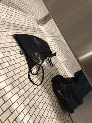 Upstairs Server puts her apron directly on the bathroom floor...