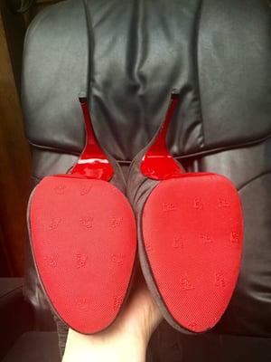 Christian Louboutin after re-soling and re-heeling