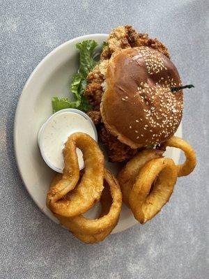 Chicken fried chicken sandwich with onion rings