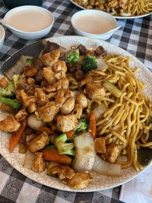 NY Chicken & Steak meal with Lo Mein and yum yum sauce on the side.