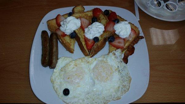 Stuffed French toast, eggs and sausage