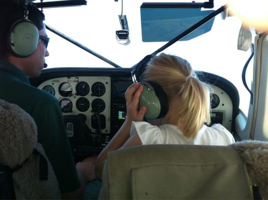 Our pilot explaining the controls to our daughter.