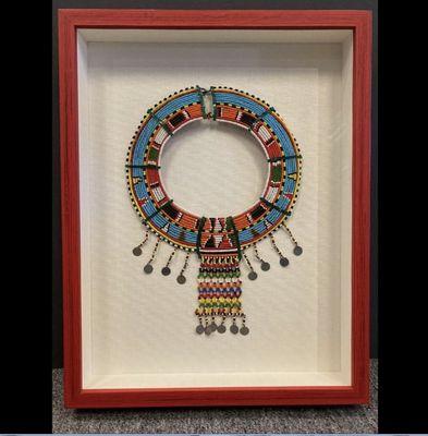 Gorgeous traditional Maasai necklace mounted on archival linen, makes an elegant statement in this vivid red shadowbox