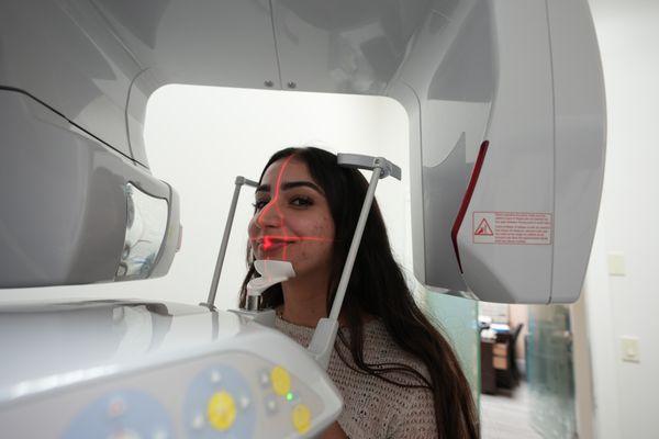 Woman going through an intraoral examination.