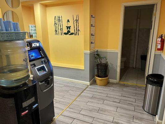 Inside the lobby with an ATM and water available