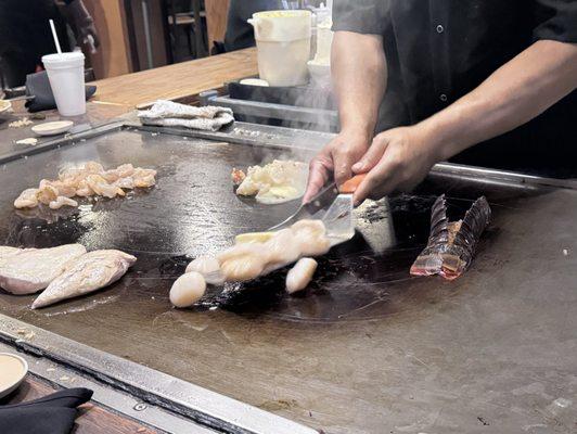 Chef cooking Seafood on Hibachi Grill