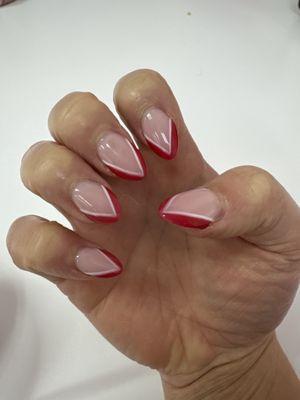 Red and white almond shaped nails.