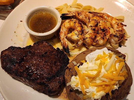 Overcooked steak, cold potato, added shrimp which were good