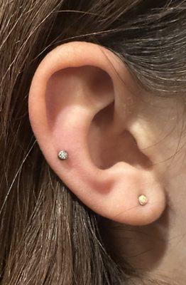 Mid helix piercing by Midori