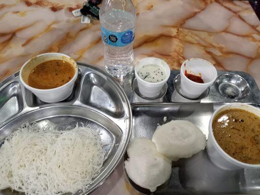 Veg kurma with idyappam and idli.