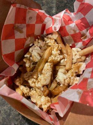 Poutine loaded with cheese curds over crispy fries