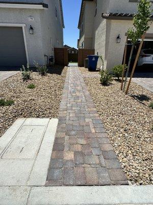 Gill matched the driveway pavers for this path and connected it to the driveway. This path makes it easier to roll our bins out.