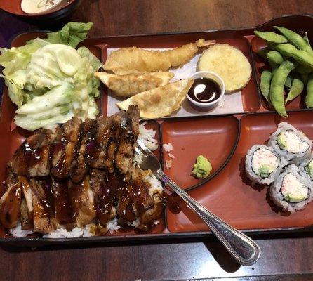 Chicken teriyaki with rice, salad, tempura, sushi rolls and edamame. Not pictured is the miso soup