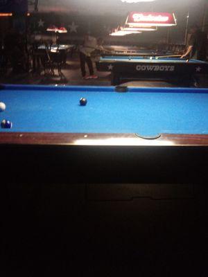 Numerous pool tables.