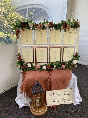 Use a large vintage window to post the seating chart... with "Please Find Your Seat" sign  set up in walkway to tent right before entrance.