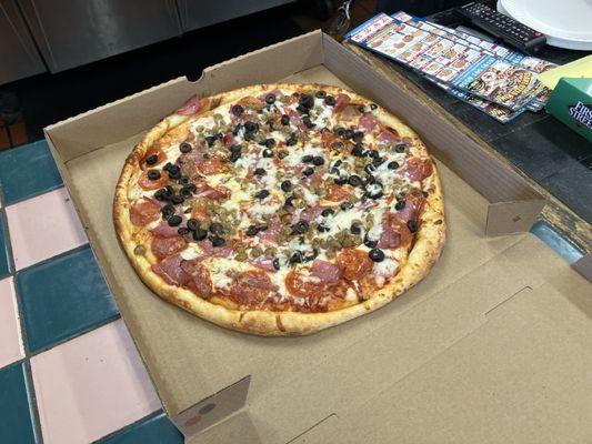 16 inch meat lovers with black olives and extra sauce ready to go, takes about 15 minutes after you finish ordering.