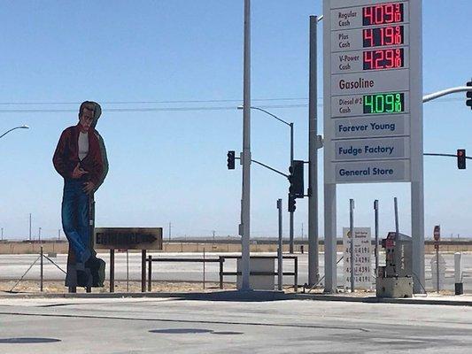 James Dean (not to scale) beckoning people to buy gas and a $35 bag of pistachios.