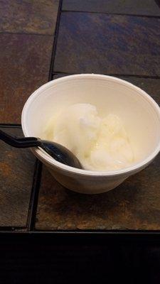 Lemon galatto with plastic spoon in Styrofoam container