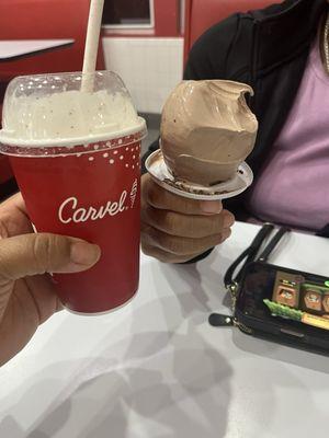 Cookies and cream milkshake and a medium chocolate cone with chocolate sprinkles.