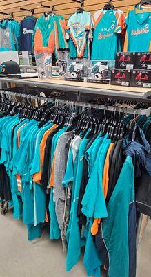 What size Miami Dolphins shirt do you need. We stock up to 6X. Let's Go Dolphins.