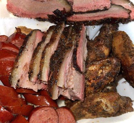 Slow Smoked meats: brisket, beef links, chicken wings