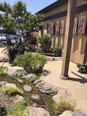 Gardens outside with crocodile and water feature